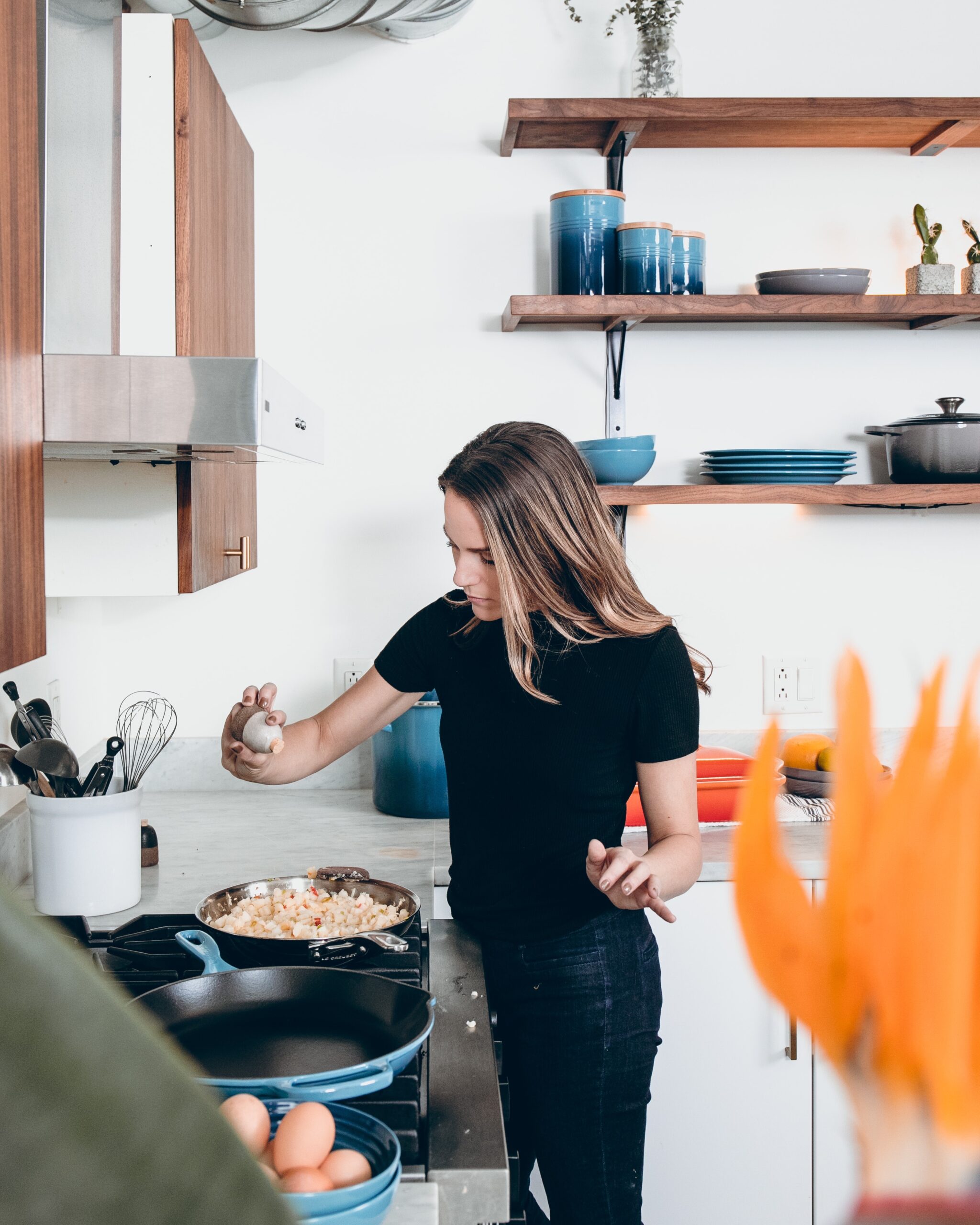 Woman cooking using kitchen tools