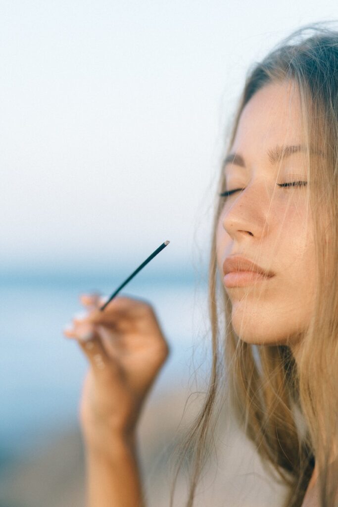 Woman Holding Incense Stick